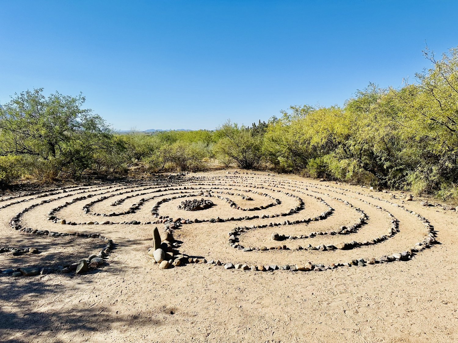 A stone labyrinth laid out on the desert floor